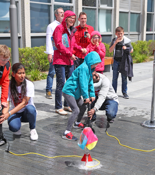 Kid preparing to launch a water rocket