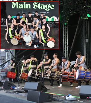 People playing drums on stage